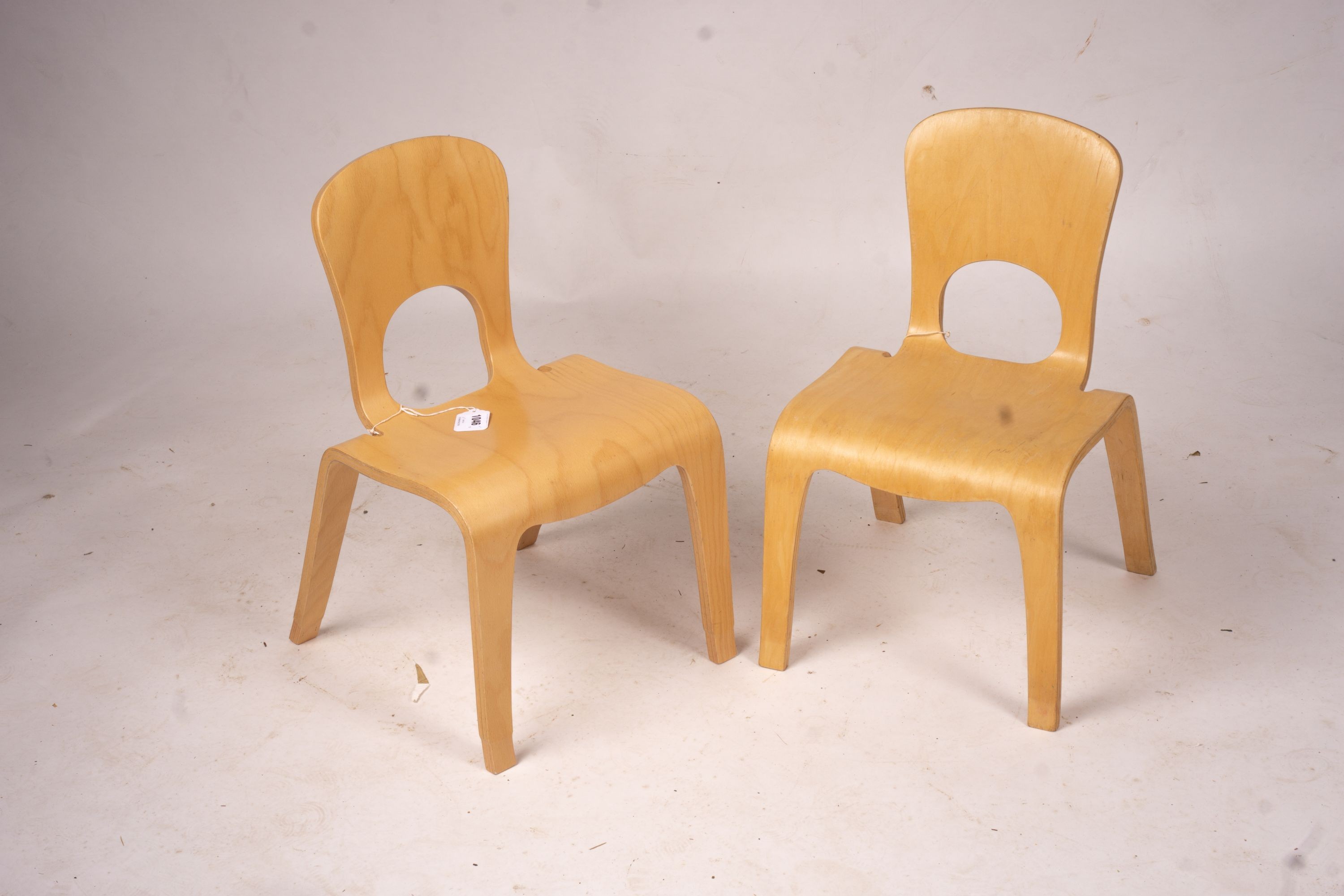 A pair of ‘Comunity’ ergonomic design children’s chairs, 55cm high max.